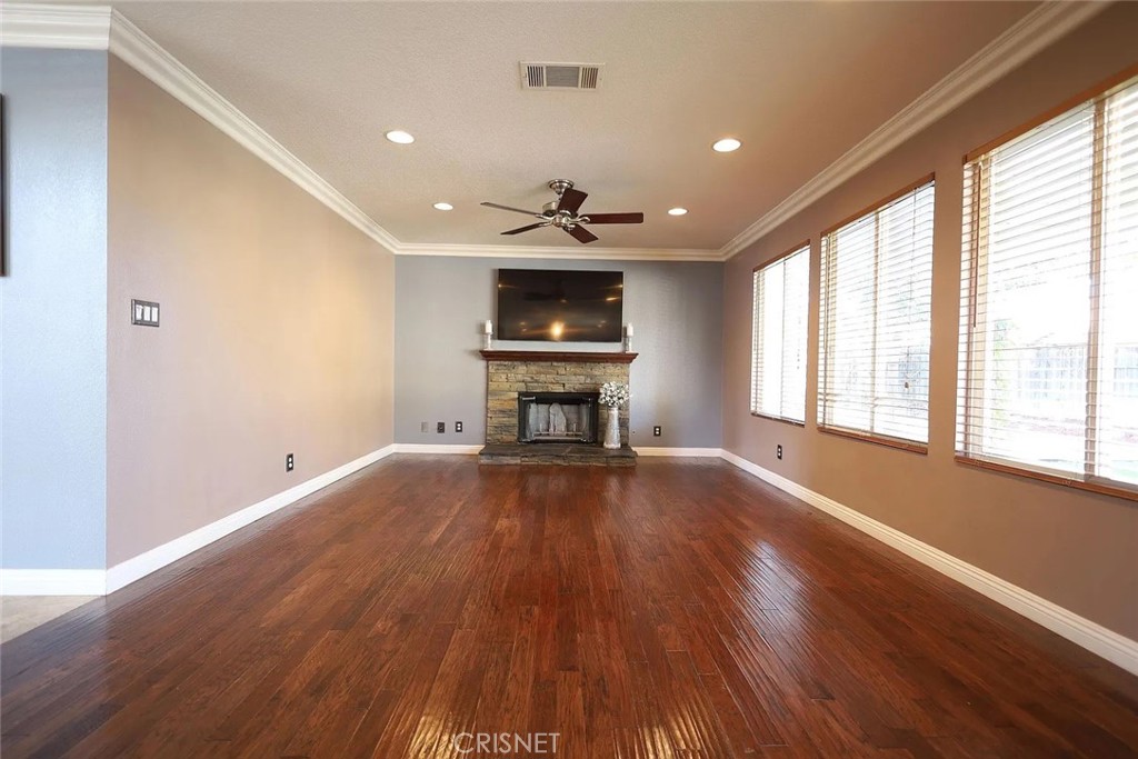 40046 Becky Lane Palmdale, CA 93551 - Photo 4 of 23 a view of empty room with wooden floor and fan