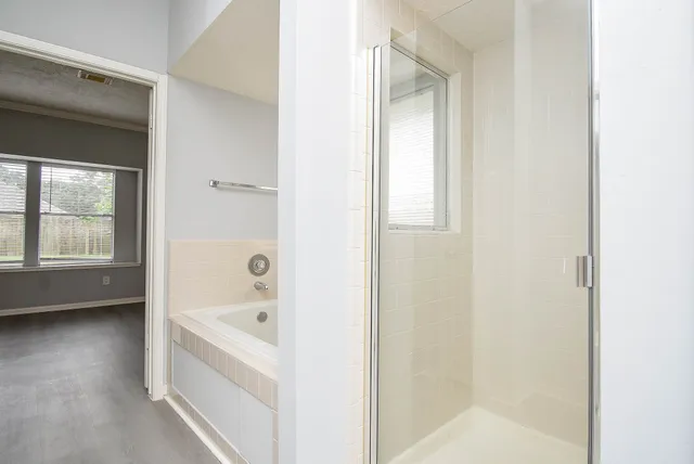 a white bath tub sitting next to a window