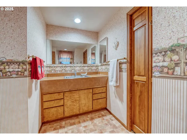 a kitchen with stainless steel appliances granite countertop a refrigerator and a stove
