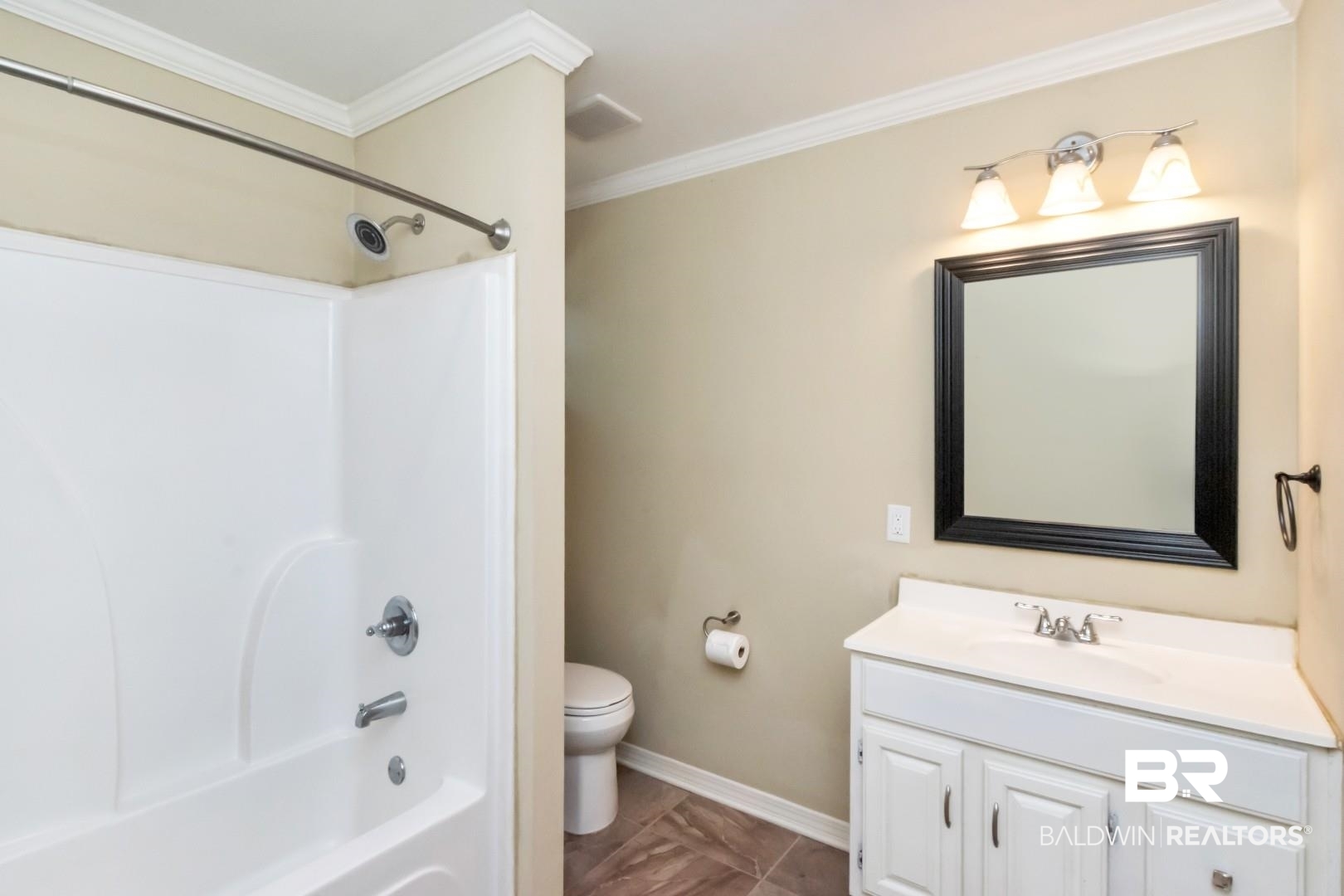 410 St John Place Mobile, AL 36609 - Photo 20 of 32 Bathroom featuring vanity, bathtub / shower combination, and ornamental molding