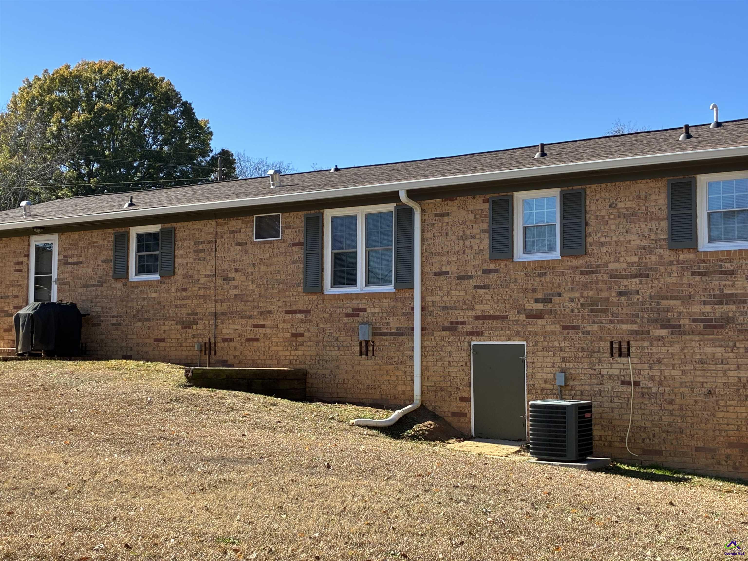 3491 Sandy Circle Macon, GA 31216 - Photo 33 of 47 a backyard of a house with barbeque oven