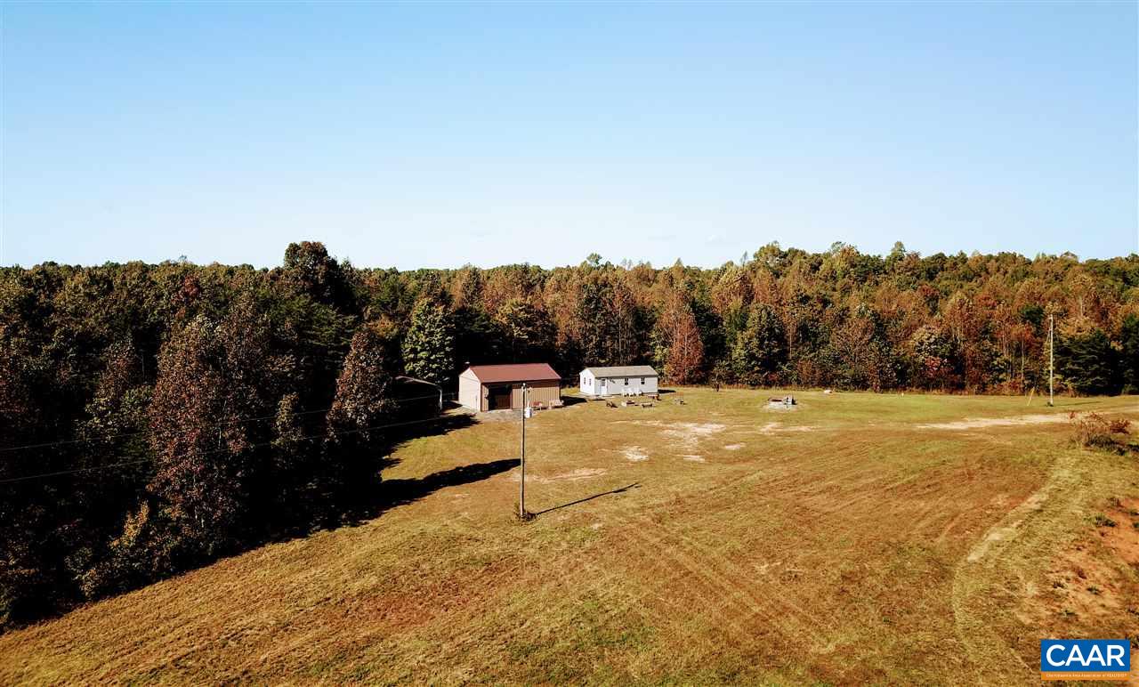 10787 Howardsville Road Howardsville, VA 24562 - Photo 14 of 41 a view of a yard with swimming pool and trees