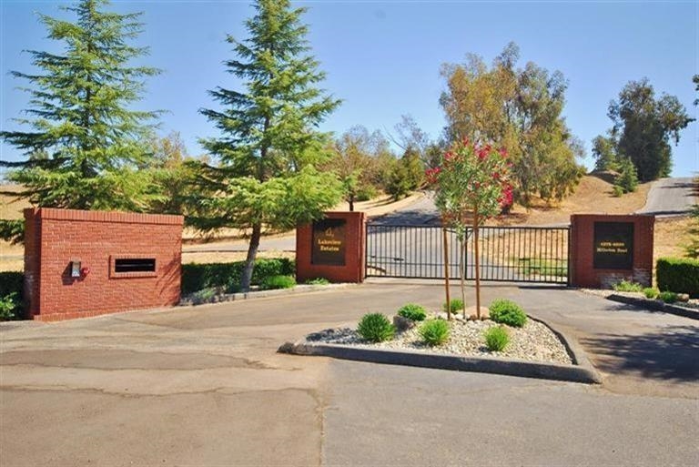4698 Millerton Road Friant, CA 93626 - Photo 7 of 9 Enter through the Lakeview Estate's security gate and drive along the paved road to your beautiful property!