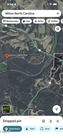 a black and white photo of a bench