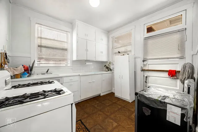 a kitchen with a stove and a refrigerator