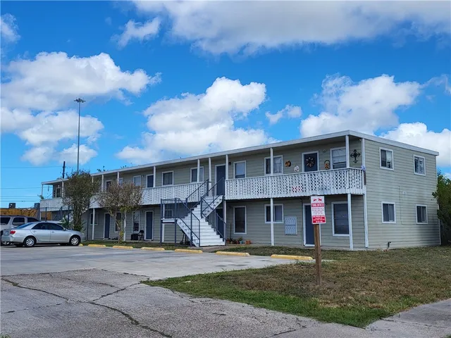 a front view of building with street