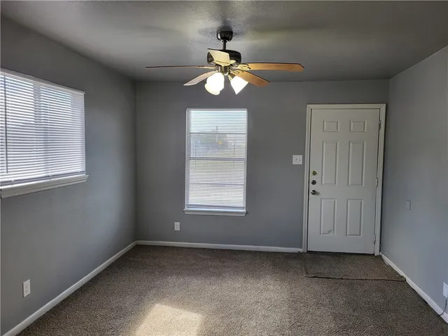 a kitchen with a refrigerator and a sink