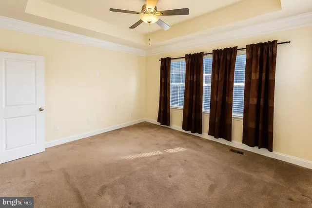 a view of a room with a window and closet