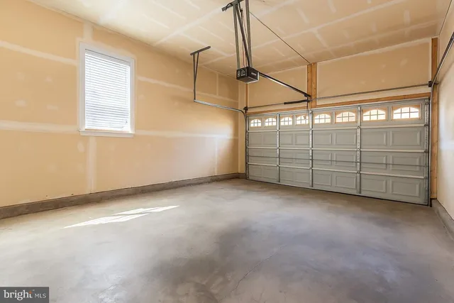 a view of a garage with stairs