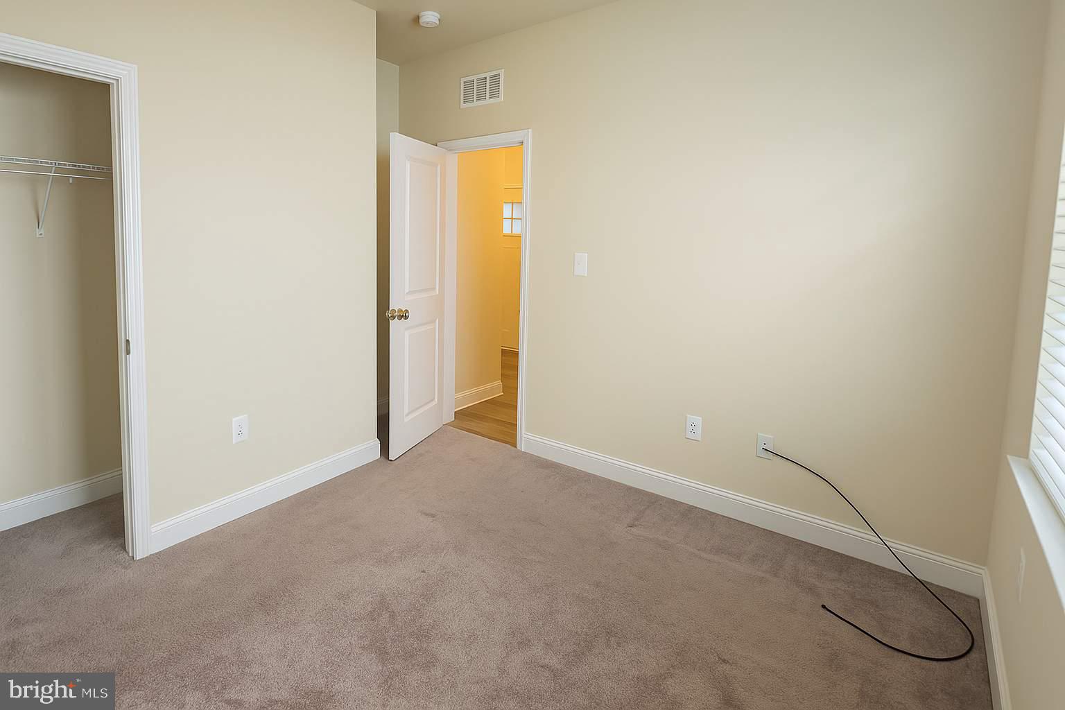 5544 Old Colony Court White Plains, MD 20695 - Photo 8 of 24 a view of an empty room