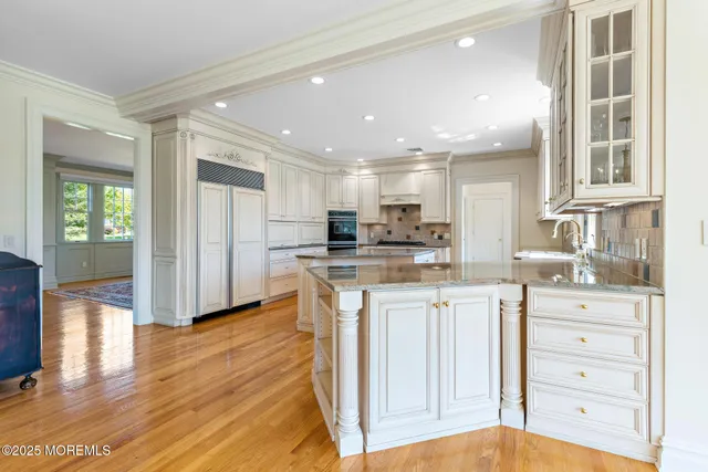 a view of a hallway with a dining table