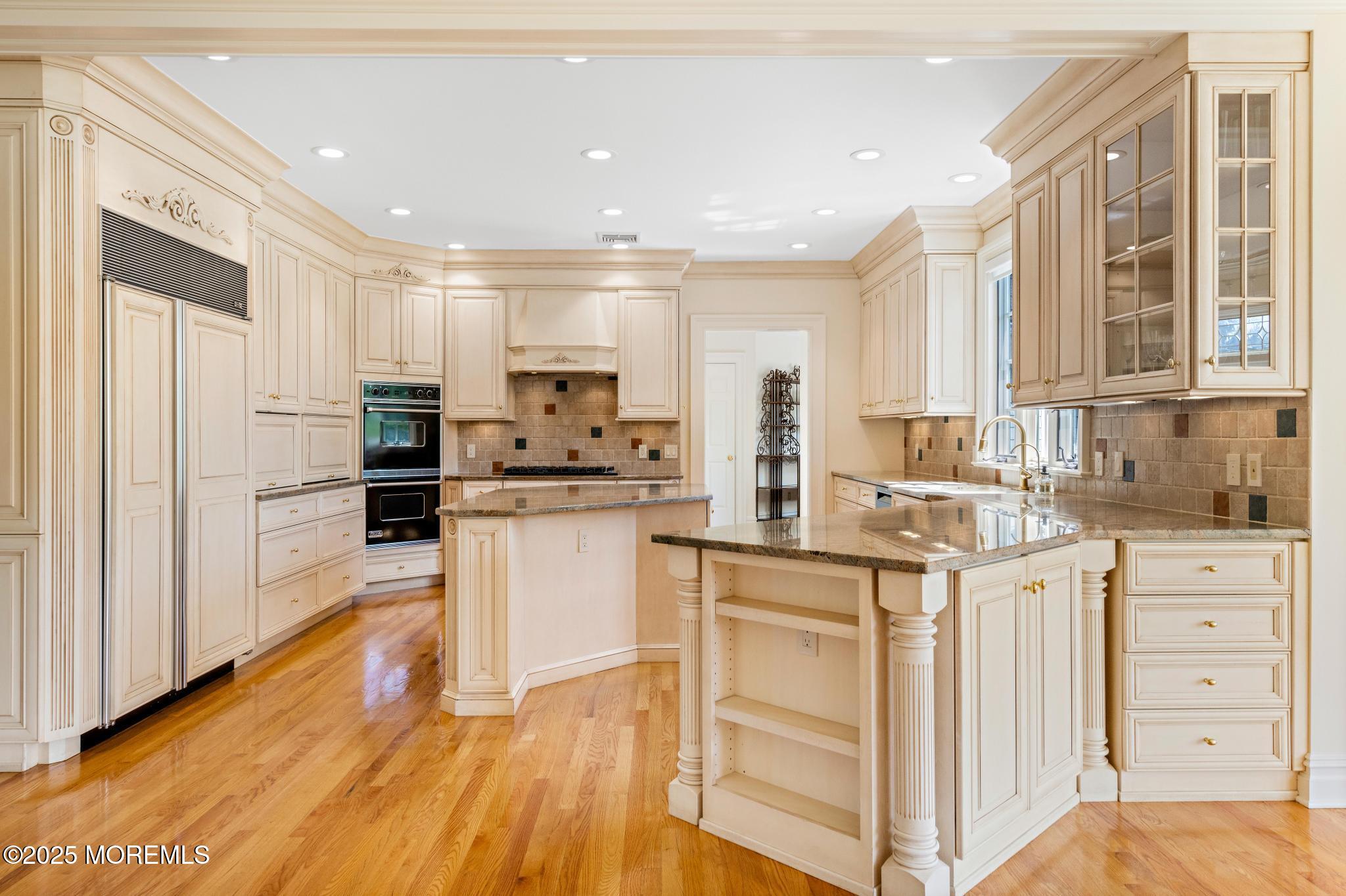 13 Driftwood Lane Colts Neck, NJ 07722 - Photo 14 of 88 a kitchen with white cabinets and appliances