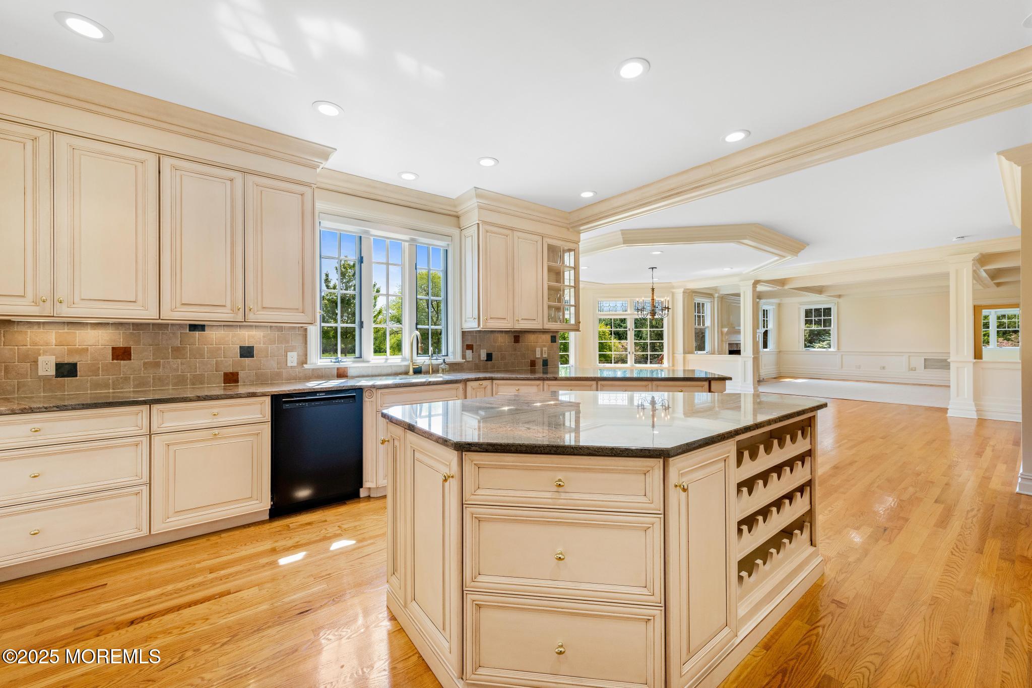 13 Driftwood Lane Colts Neck, NJ 07722 - Photo 15 of 88 a kitchen with granite countertop a sink and cabinets