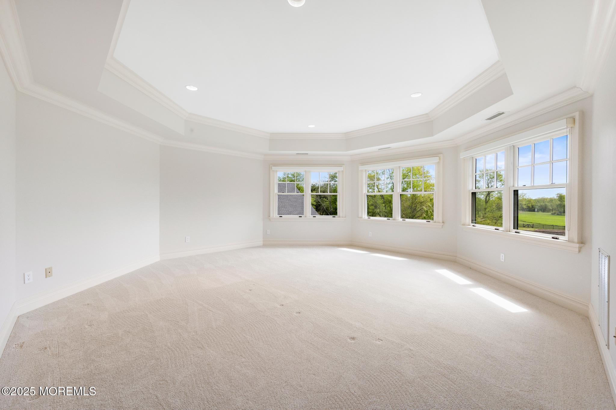 13 Driftwood Lane Colts Neck, NJ 07722 - Photo 31 of 88 a view of a big room with windows and chandelier fan