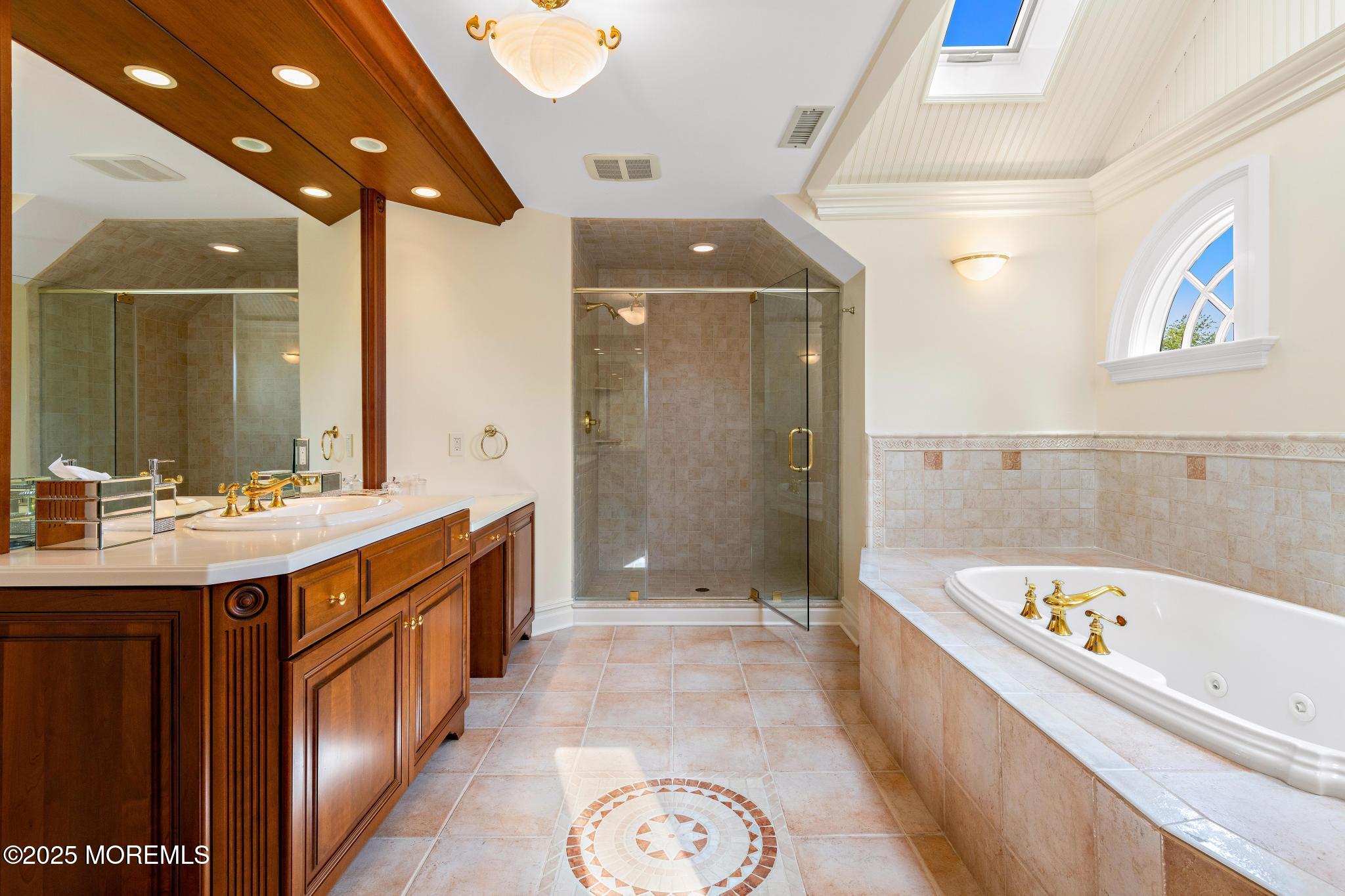13 Driftwood Lane Colts Neck, NJ 07722 - Photo 35 of 88 a bathroom with a bathtub a sink and a shower