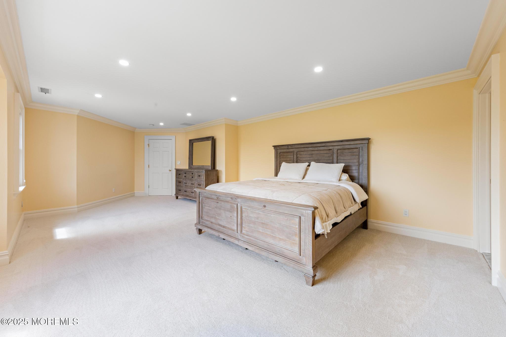 13 Driftwood Lane Colts Neck, NJ 07722 - Photo 37 of 88 a spacious bedroom with a bed and a couch