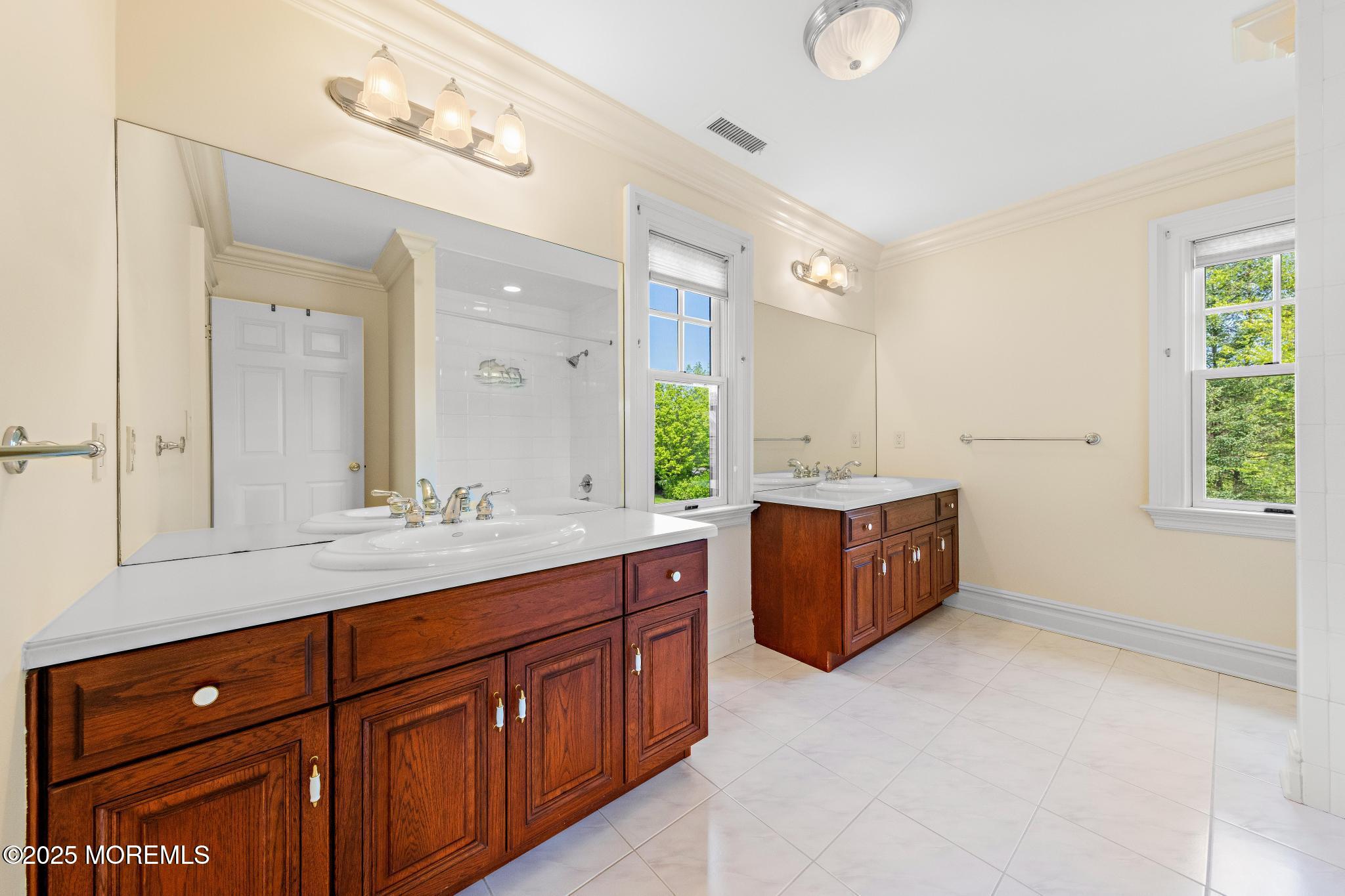 13 Driftwood Lane Colts Neck, NJ 07722 - Photo 39 of 88 a spacious bathroom with a granite countertop double vanity sink mirror and a