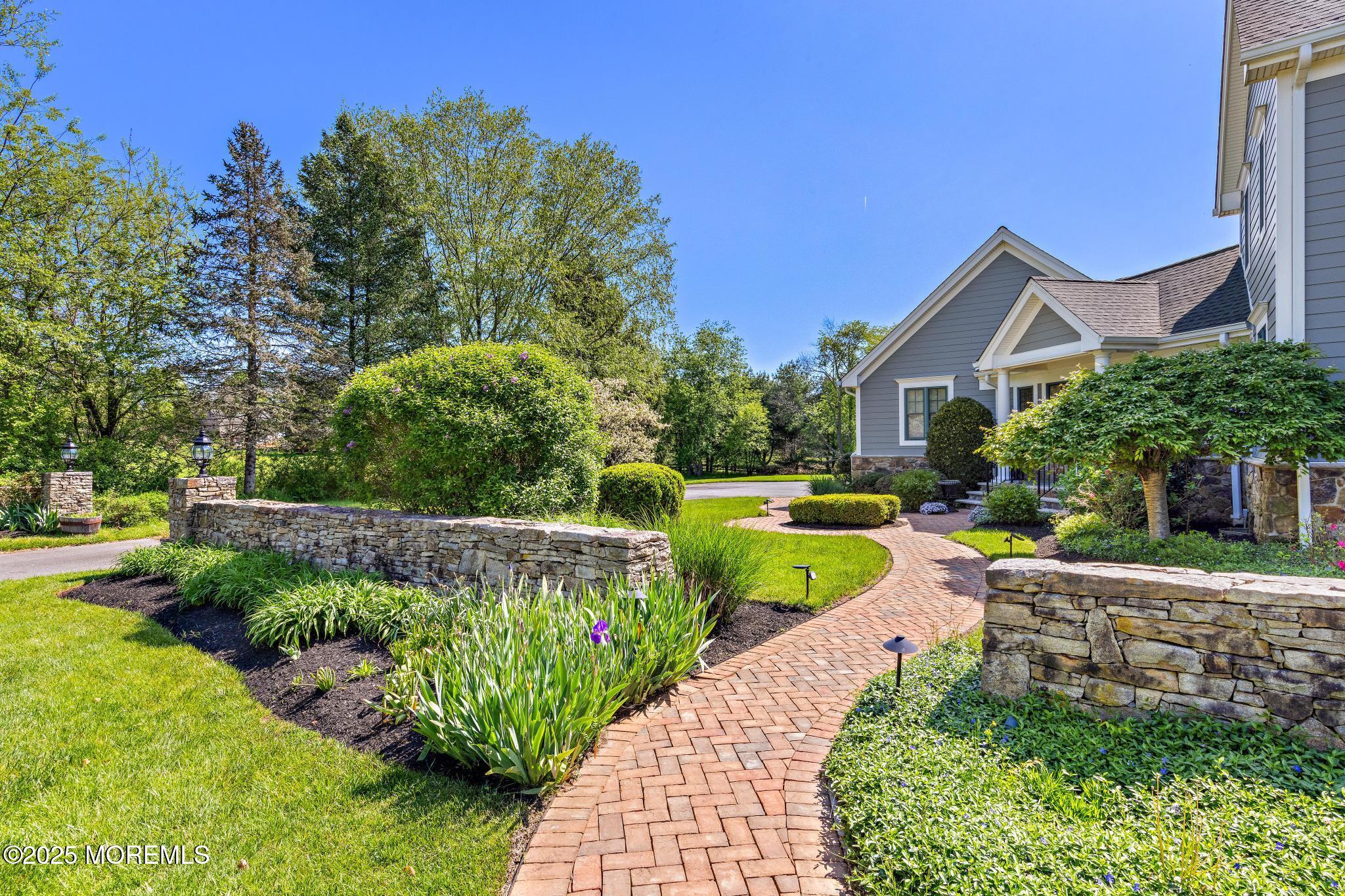 13 Driftwood Lane Colts Neck, NJ 07722 - Photo 46 of 88 a view of an house with backyard space and garden