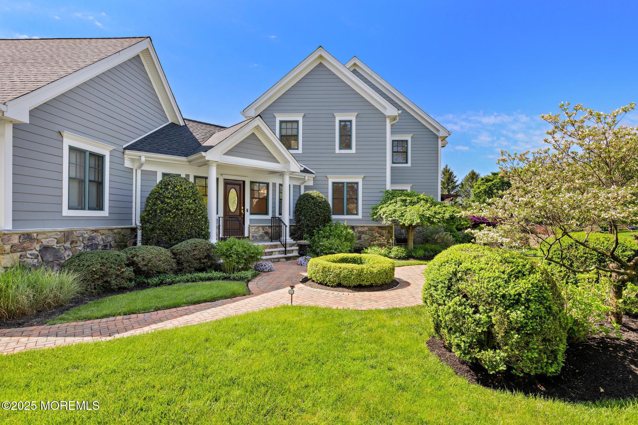 13 Driftwood Lane Colts Neck, NJ 07722 - Photo 47 of 88 a front view of a house with garden