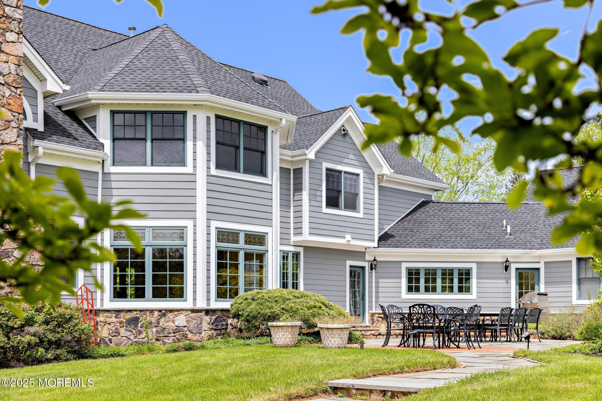 13 Driftwood Lane Colts Neck, NJ 07722 - Photo 48 of 88 a front view of a house with garden