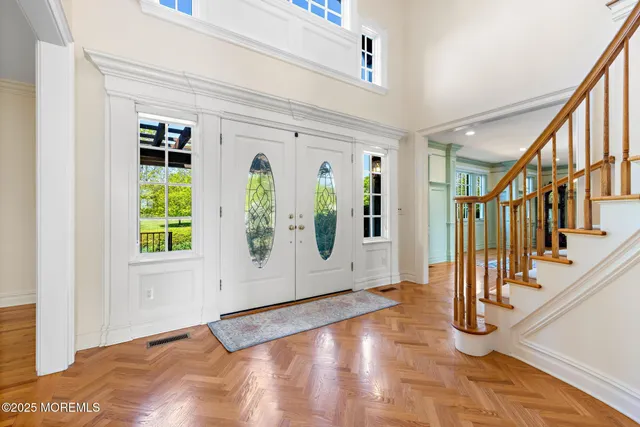 a view of a living room and floor to ceiling window