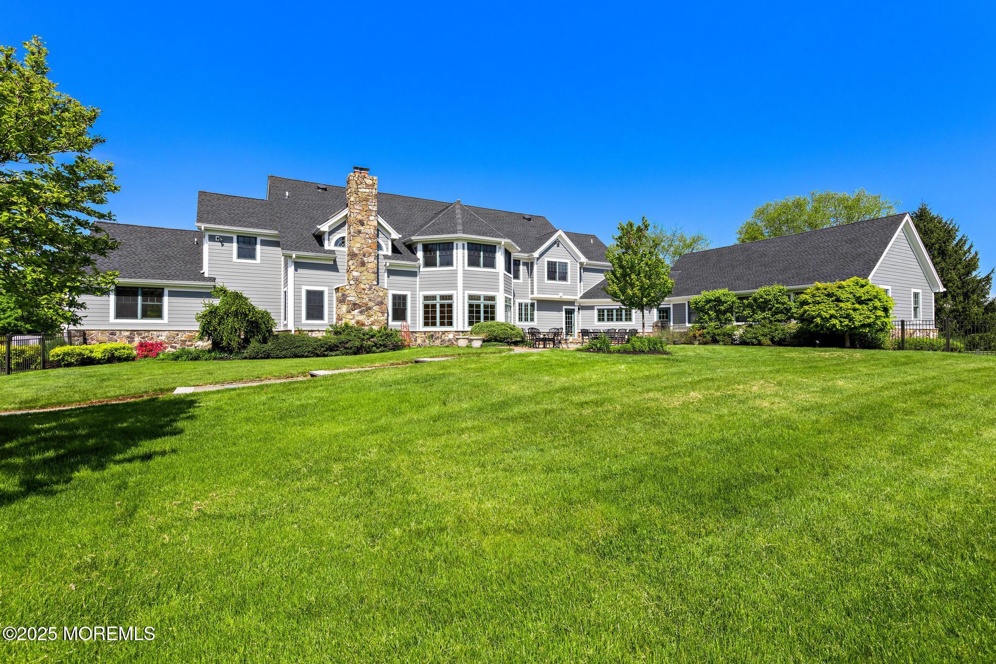 13 Driftwood Lane Colts Neck, NJ 07722 - Photo 57 of 88 a front view of a house with a yard