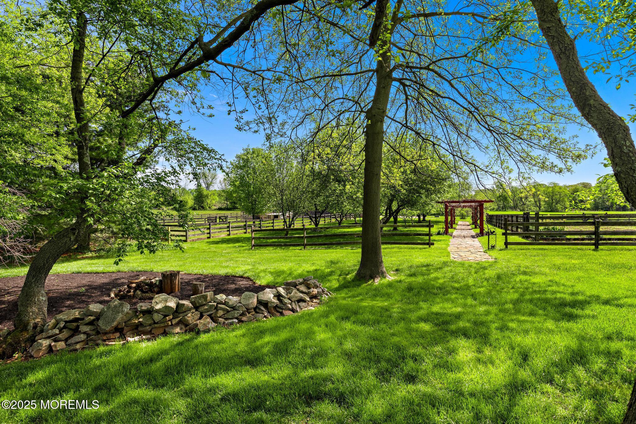 13 Driftwood Lane Colts Neck, NJ 07722 - Photo 59 of 88 a view of a park with large trees
