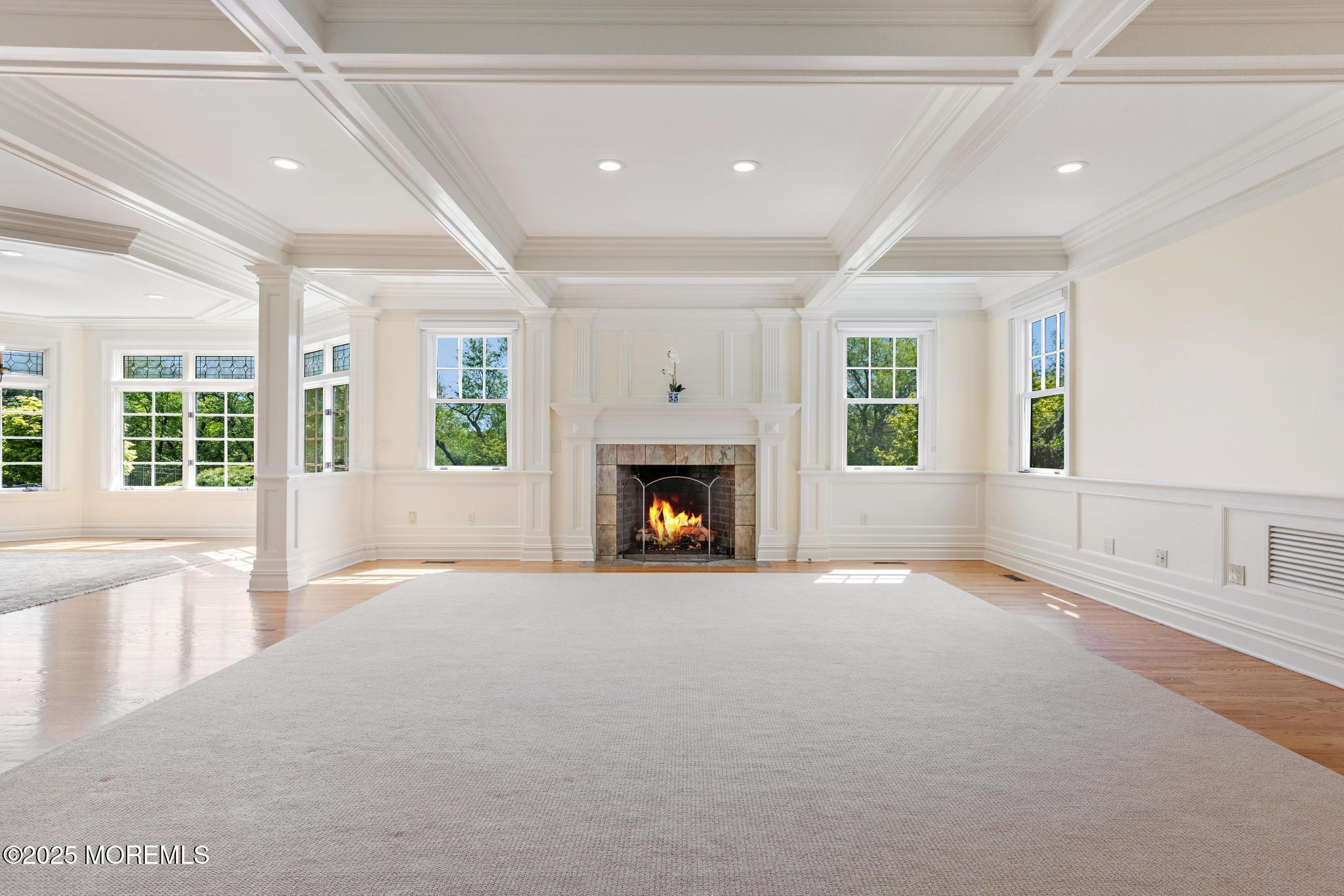 13 Driftwood Lane Colts Neck, NJ 07722 - Photo 7 of 88 a view of an empty room with a fireplace and a window