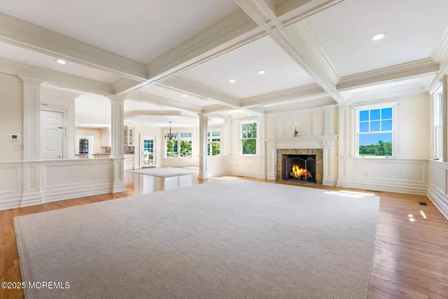 a kitchen with white cabinets and appliances