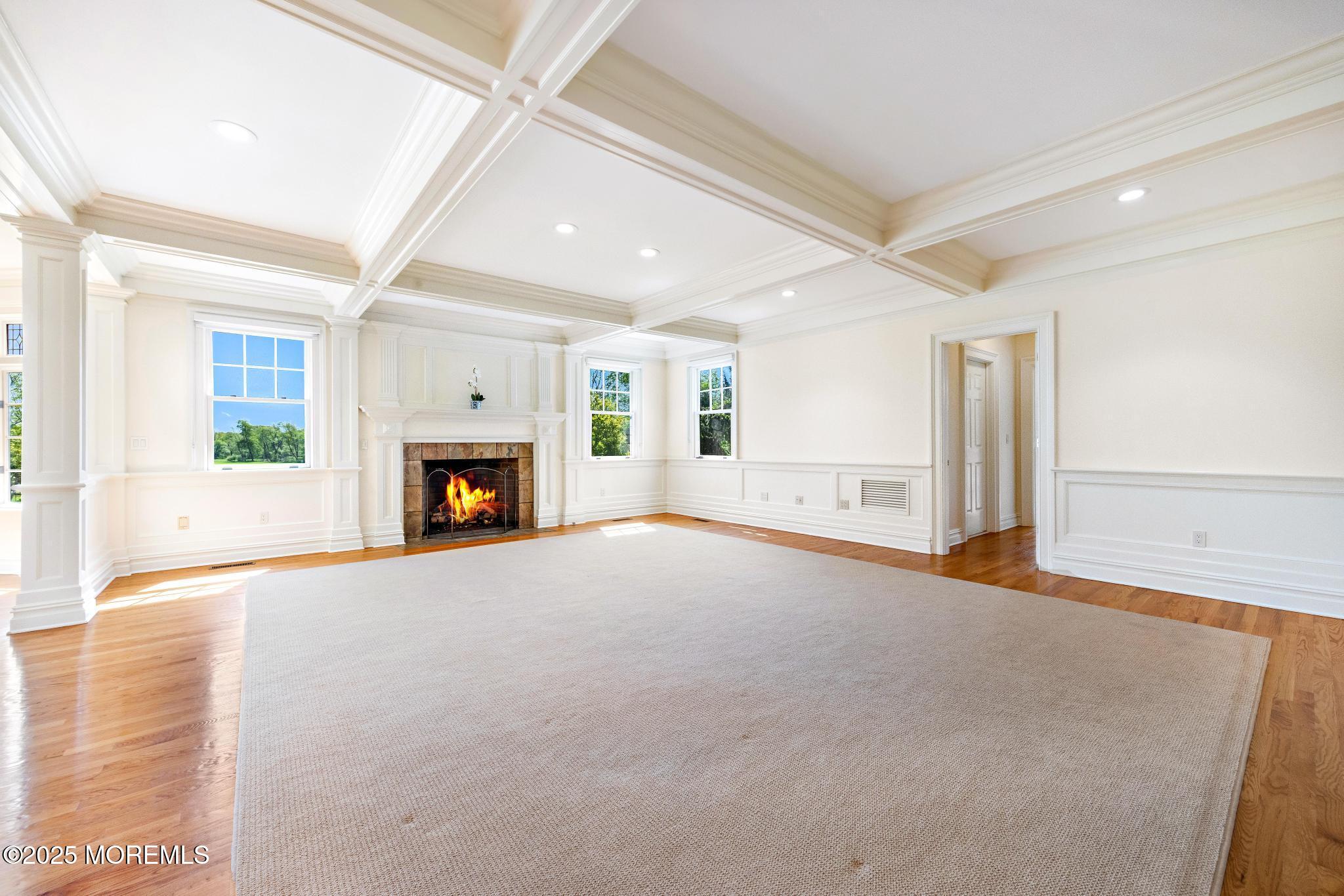 13 Driftwood Lane Colts Neck, NJ 07722 - Photo 9 of 88 a view of empty room with a fireplace and wooden floor