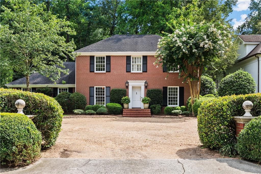 3468 Valley Road Northwest Atlanta, GA 30305 - Photo 1 of 1 a front view of a house with a garden