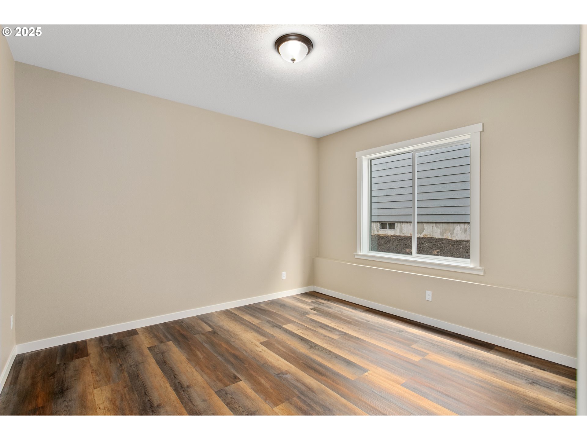 144 East H Street Vernonia, OR 97064 - Photo 11 of 35 a view of an empty room with a window