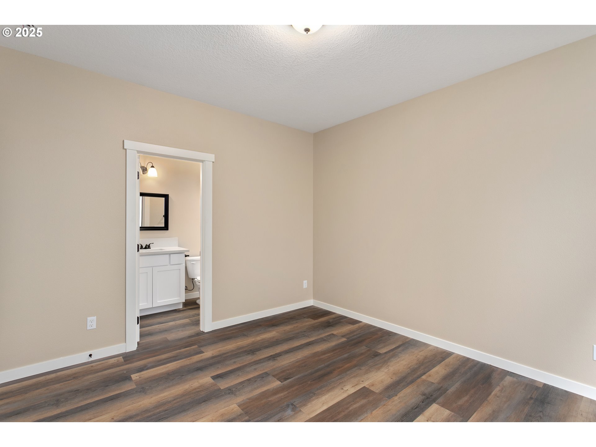 144 East H Street Vernonia, OR 97064 - Photo 13 of 35 a view of empty room with wooden floor