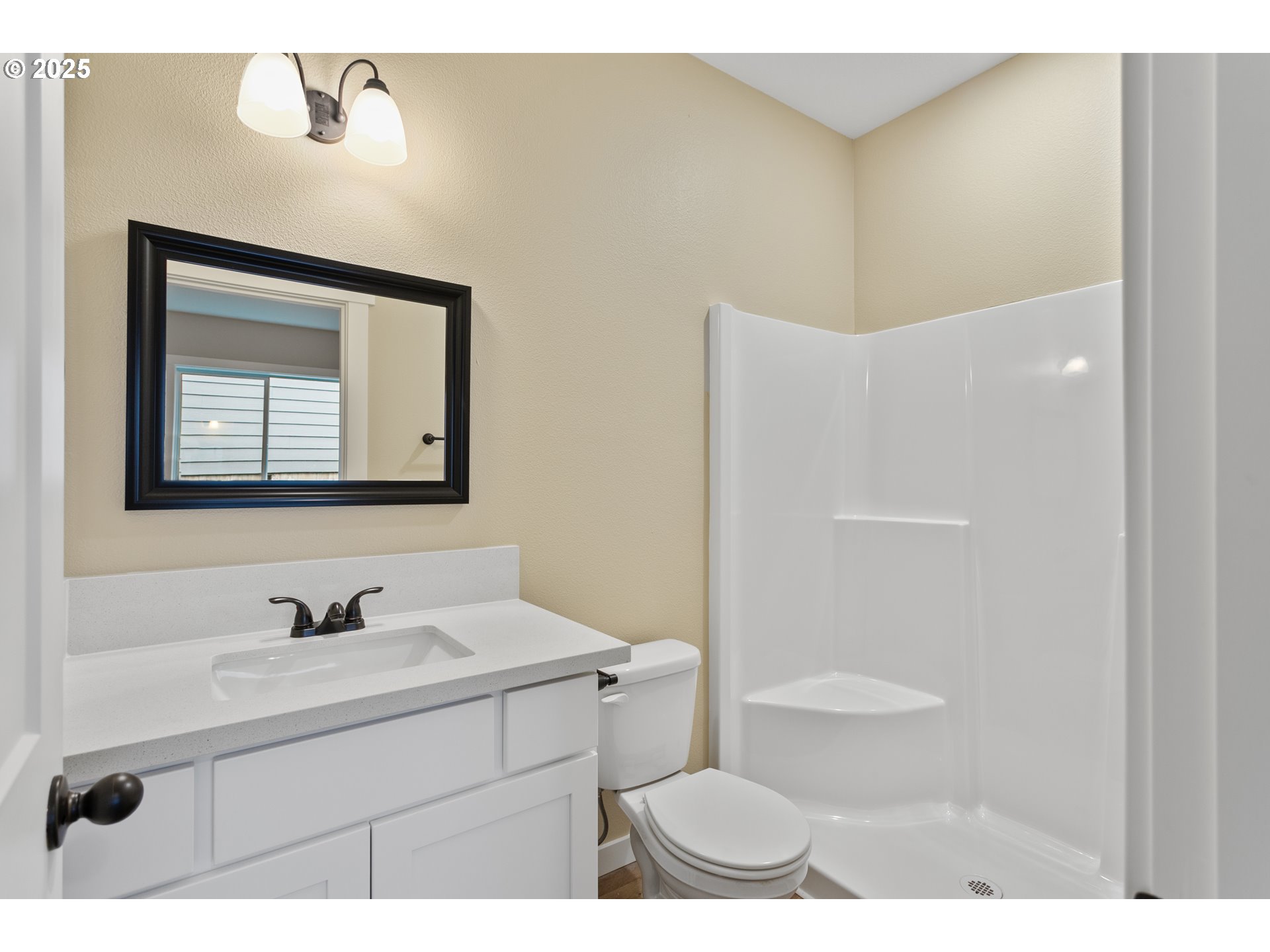 144 East H Street Vernonia, OR 97064 - Photo 14 of 35 a bathroom with a sink a toilet and a mirror