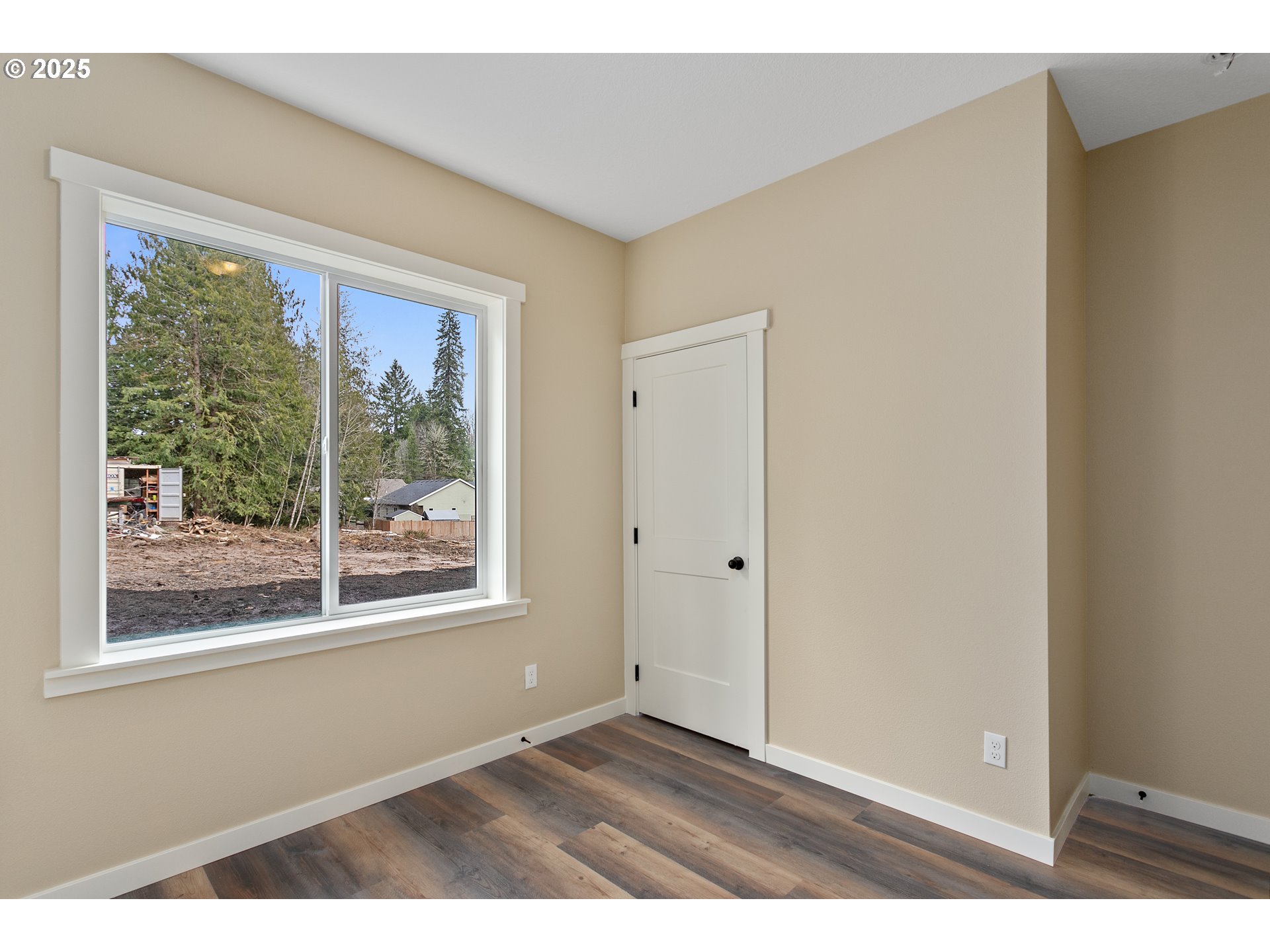 144 East H Street Vernonia, OR 97064 - Photo 16 of 35 a view of an empty room with a window