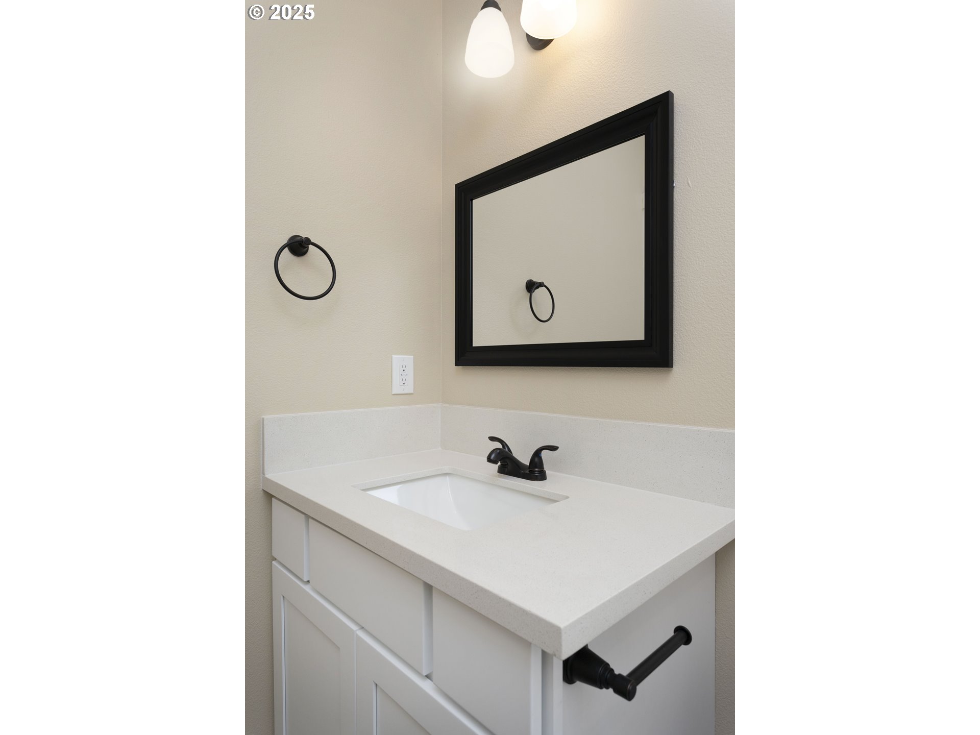 144 East H Street Vernonia, OR 97064 - Photo 17 of 35 a bathroom with a sink a mirror and vanity
