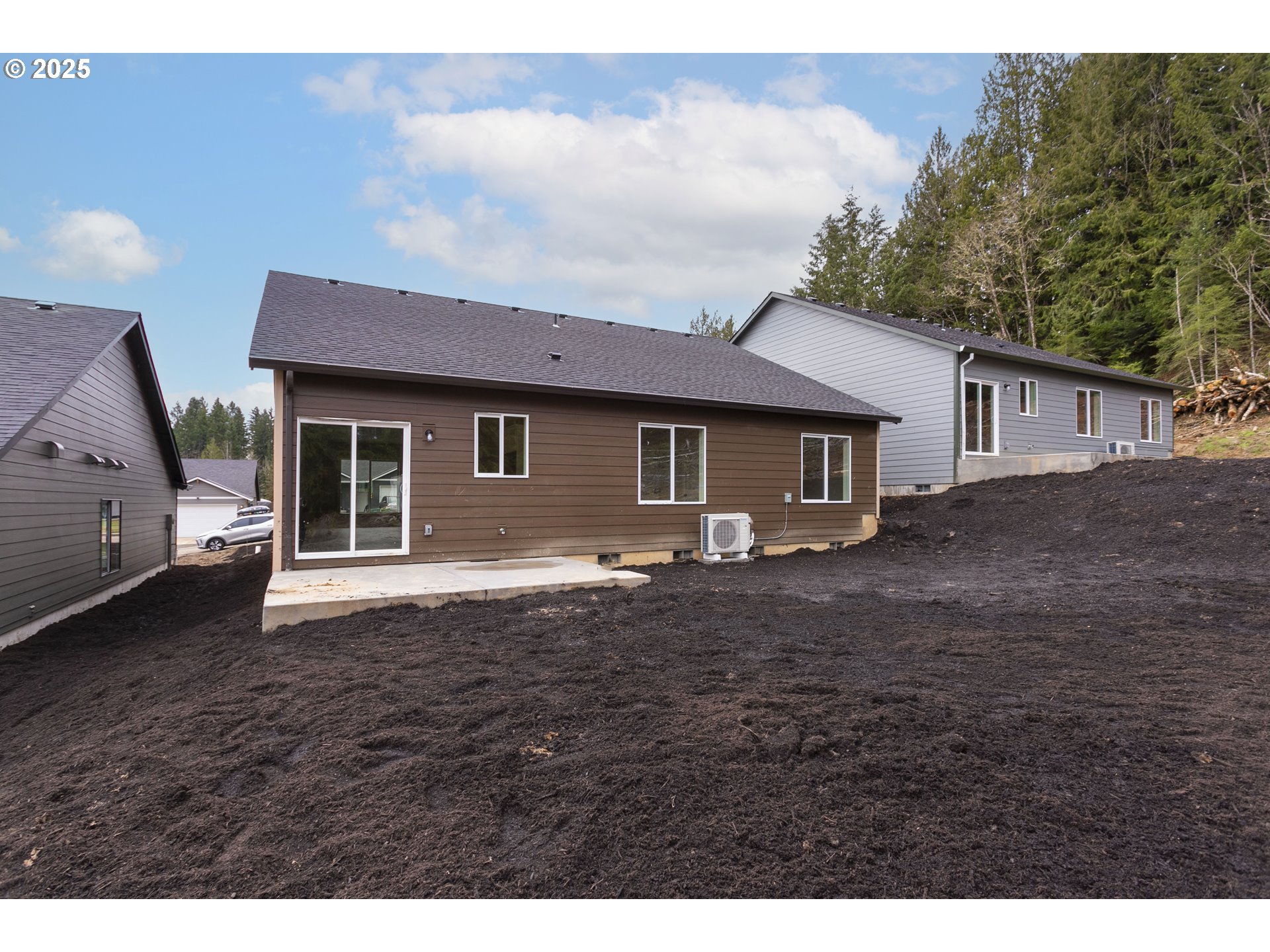 144 East H Street Vernonia, OR 97064 - Photo 20 of 35 a view of a yard in front of a house with a large tree