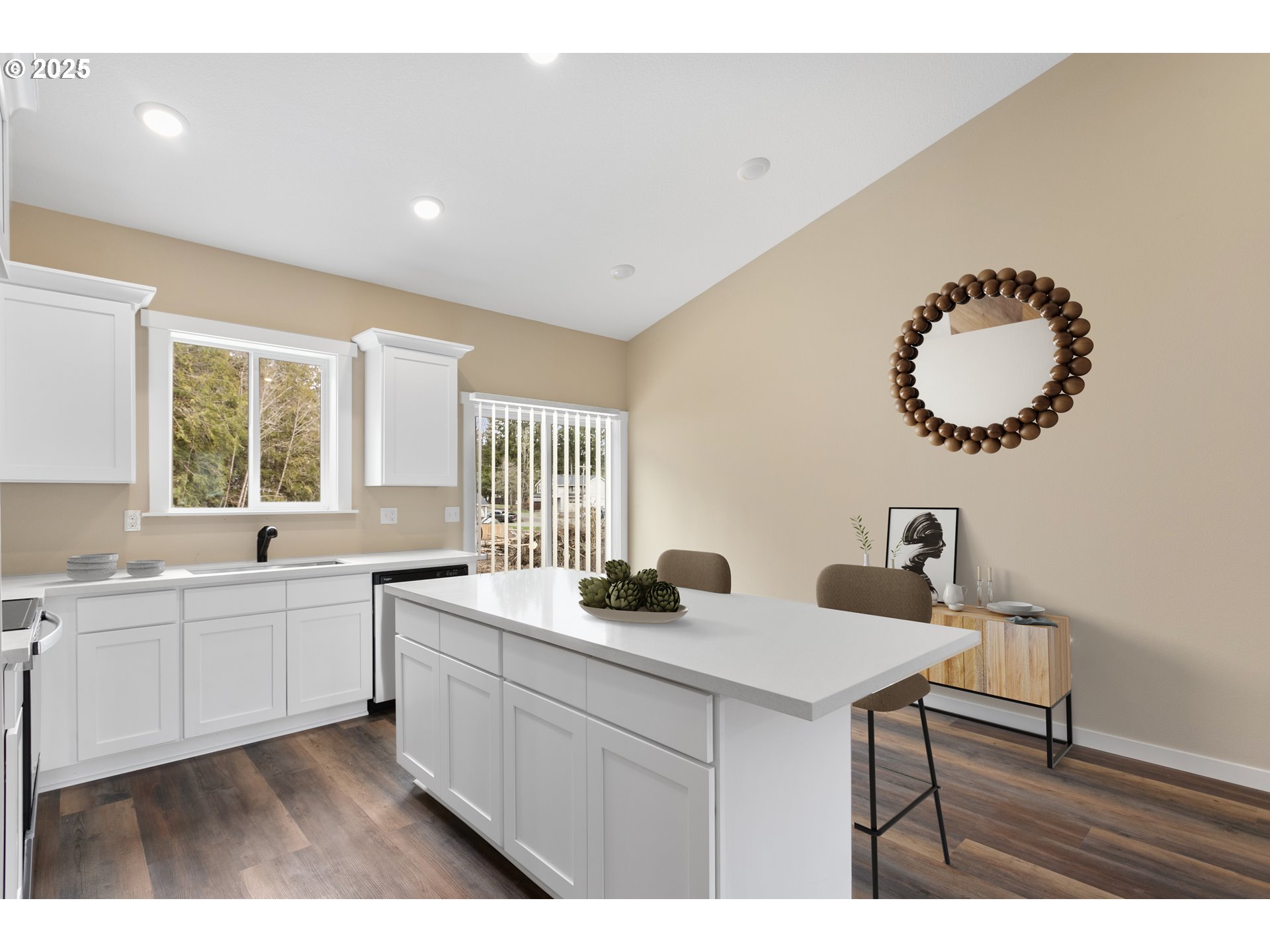 144 East H Street Vernonia, OR 97064 - Photo 8 of 35 a kitchen with white cabinets a sink and dishwasher
