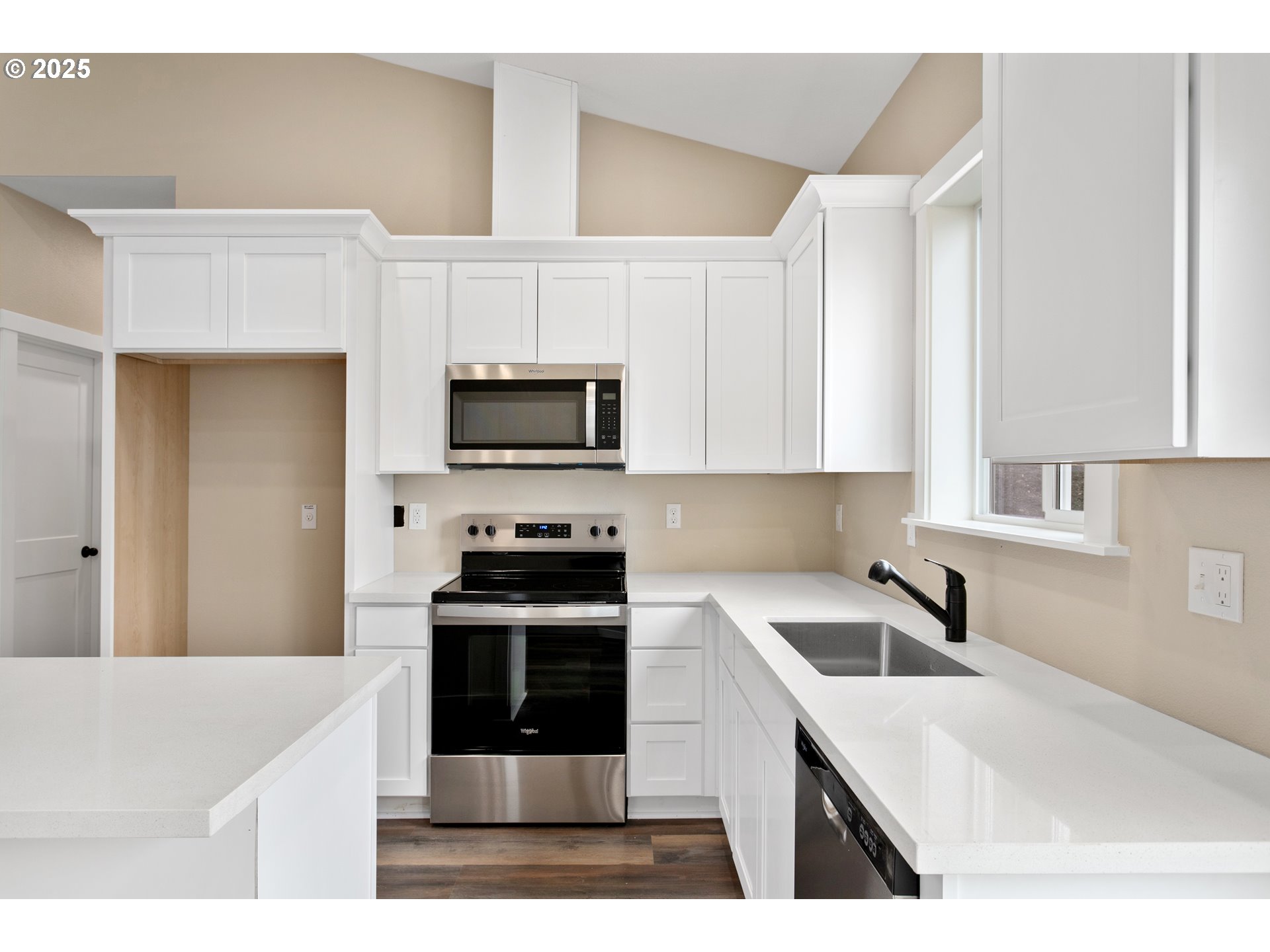 144 East H Street Vernonia, OR 97064 - Photo 10 of 35 a kitchen with stainless steel appliances granite countertop a sink stove and microwave