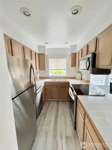 a view of a livingroom with furniture and window