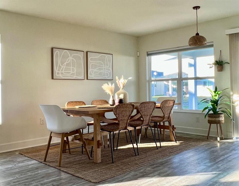 2791 Mdw Strm Way Clermont, FL 34714 - Photo 5 of 11 a view of a dining room with furniture window and wooden floor