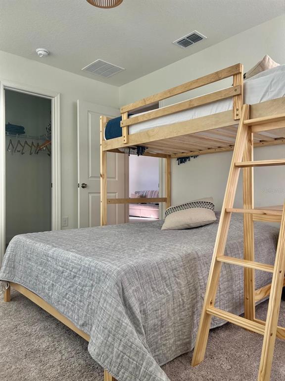 2791 Mdw Strm Way Clermont, FL 34714 - Photo 6 of 11 a bedroom with a bed and a window