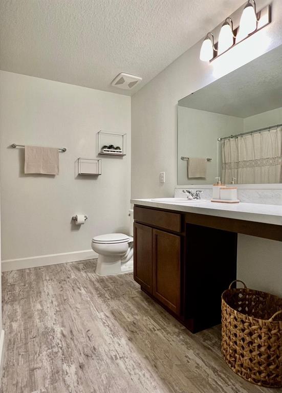 2791 Mdw Strm Way Clermont, FL 34714 - Photo 7 of 11 a bathroom with a sink vanity and a toilet