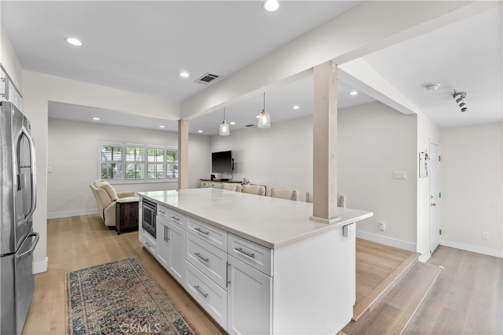 2053 Middlebrook Road Torrance, CA 90501 - Photo 11 of 45 a large white kitchen with a stove a sink dishwasher and a refrigerator