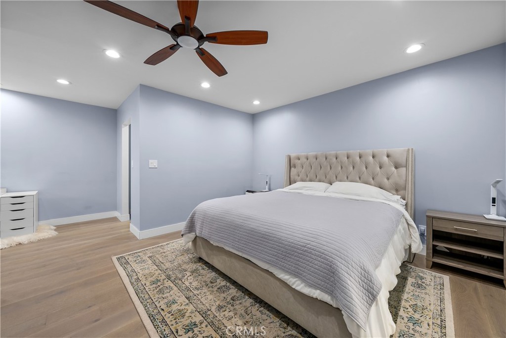 2053 Middlebrook Road Torrance, CA 90501 - Photo 28 of 45 a bedroom with a large bed chandelier and a window