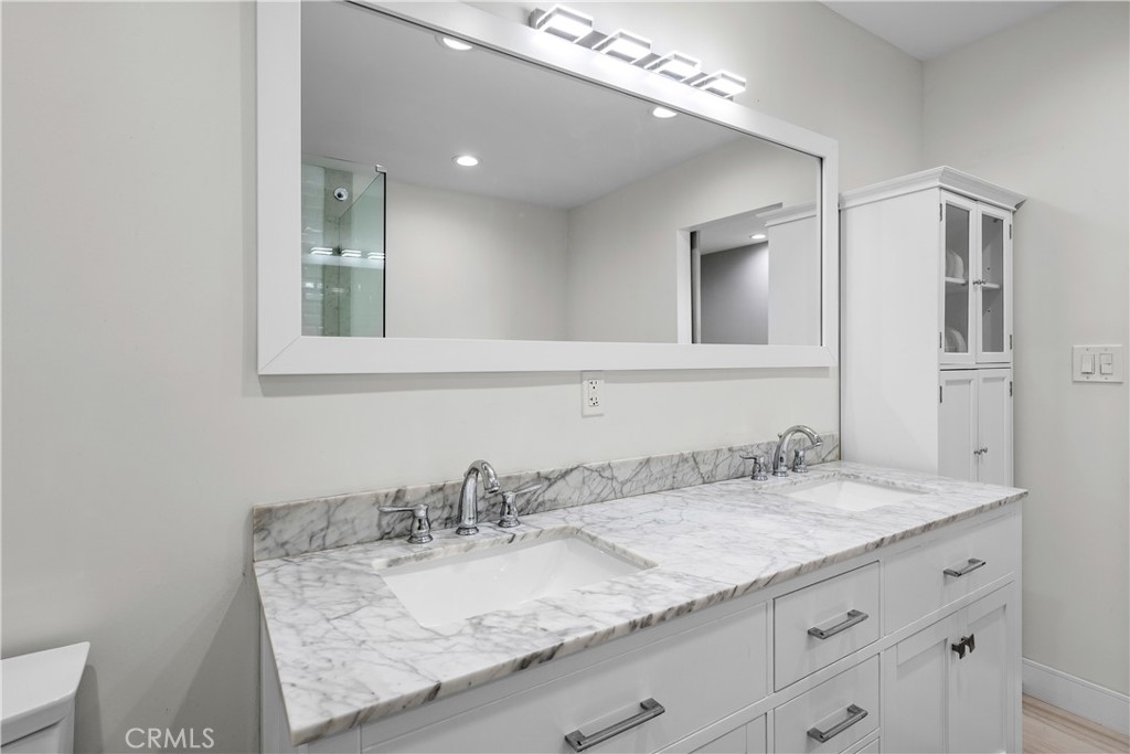 2053 Middlebrook Road Torrance, CA 90501 - Photo 33 of 45 a bathroom with a granite countertop sink and a mirror