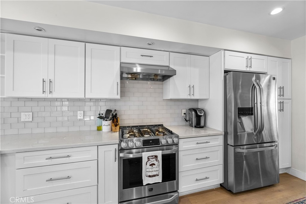 2053 Middlebrook Road Torrance, CA 90501 - Photo 7 of 45 a kitchen with appliances a refrigerator and cabinets