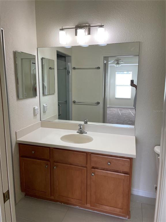 9027 Stone Harbour Loop Bradenton, FL 34212 - Photo 13 of 20 a bathroom with a sink and a mirror
