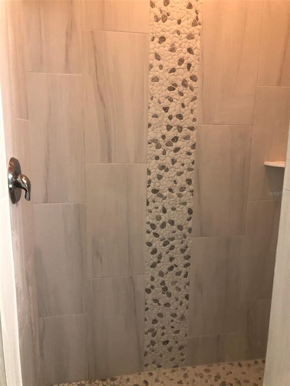 9027 Stone Harbour Loop Bradenton, FL 34212 - Photo 14 of 20 a bathroom with a shower and a sink