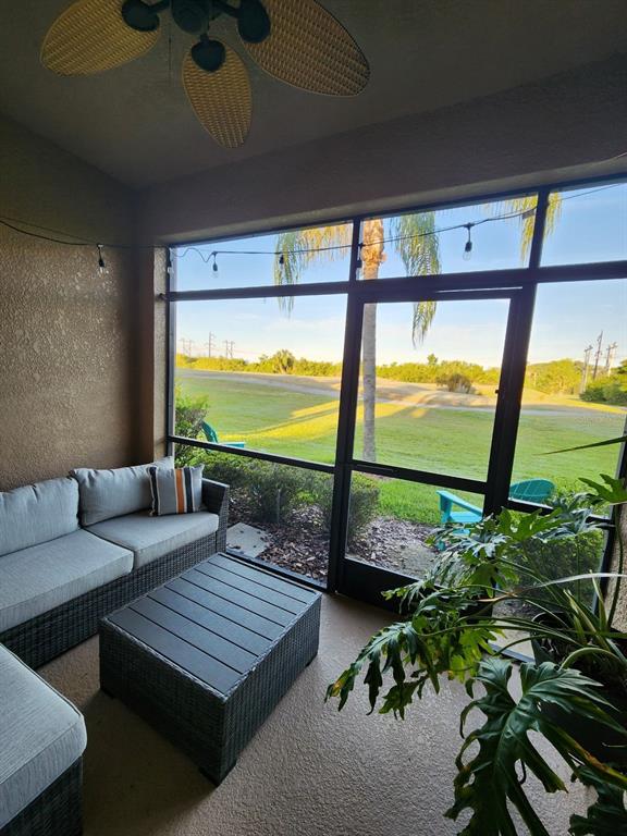 9027 Stone Harbour Loop Bradenton, FL 34212 - Photo 18 of 20 a living room with large windows